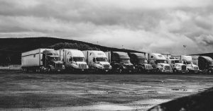 Parked Trucks Under Clouds